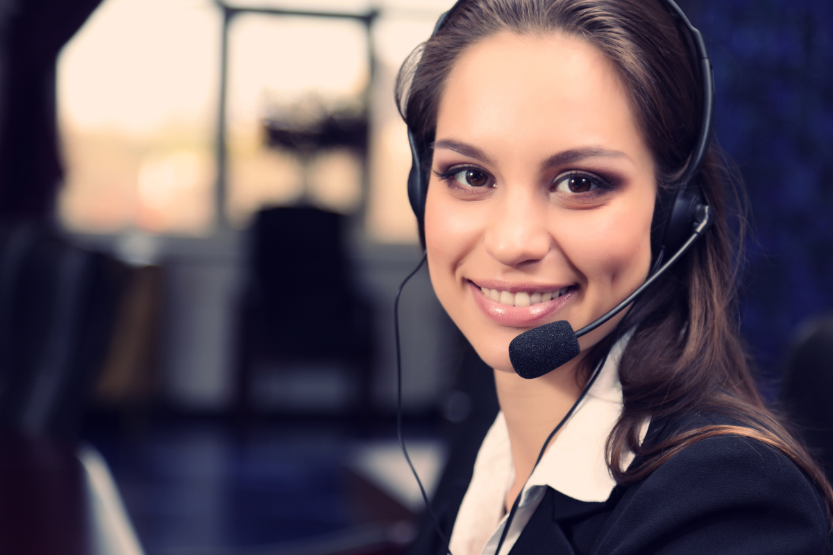 A smiling contact center employee