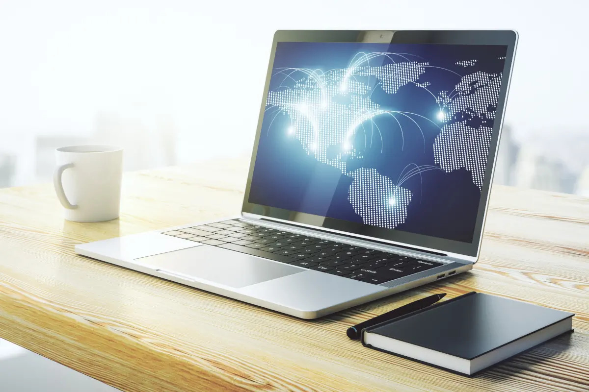 Laptop with image of world map connections