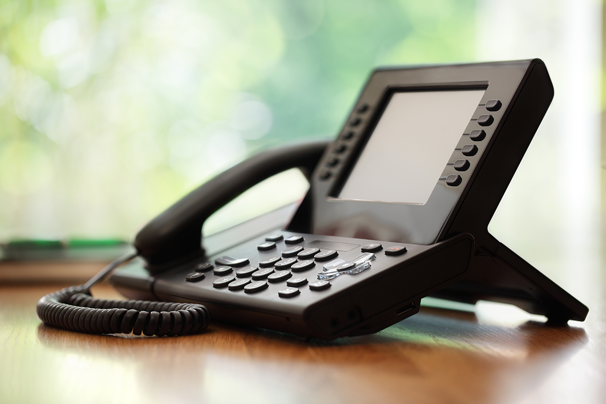 Business phone sitting on a table