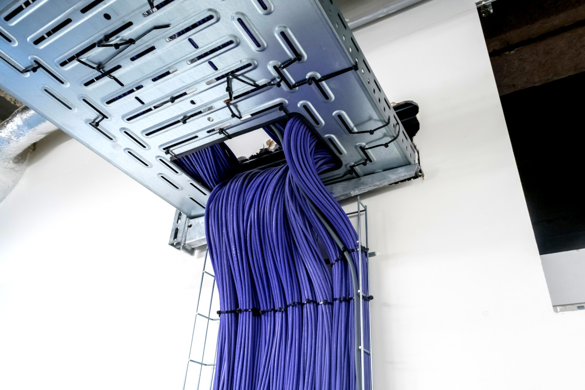 Blue cables coming out of a ceiling