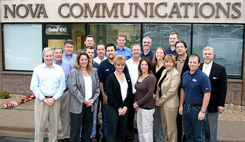 Nova Technologies Team Standing in Front of Office Building